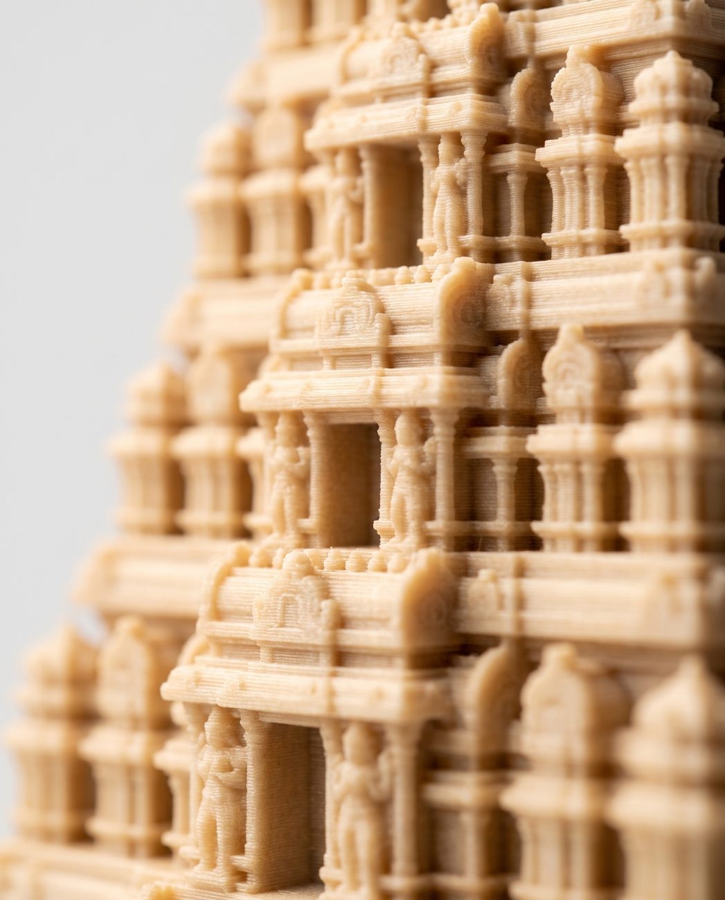 Close-up of the carved tiers of the Gopuram Manjal–Kumkum Holder